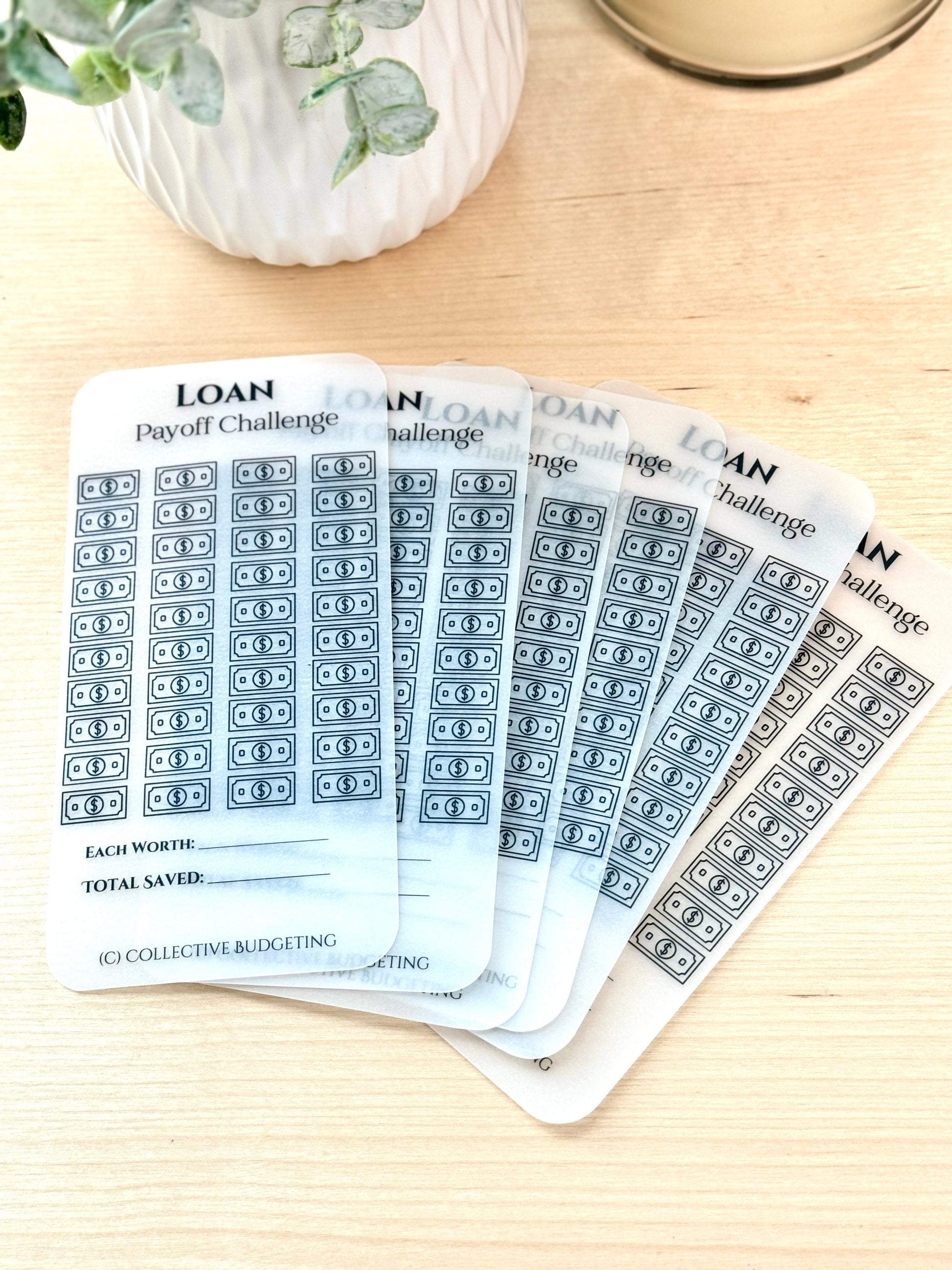 Six white cards with black text and graphics. The cards are labeled 'LOAN Payoff Challenge.' Each card has a grid of 50 dollar bill graphics. The cards are stacked on top of each other. The text 'EACH WORTH:' and 'TOTAL SAVED:' is at the bottom of the top card. The text '(C) COLLECTIVE BUDGETING' is at the bottom of the top card.