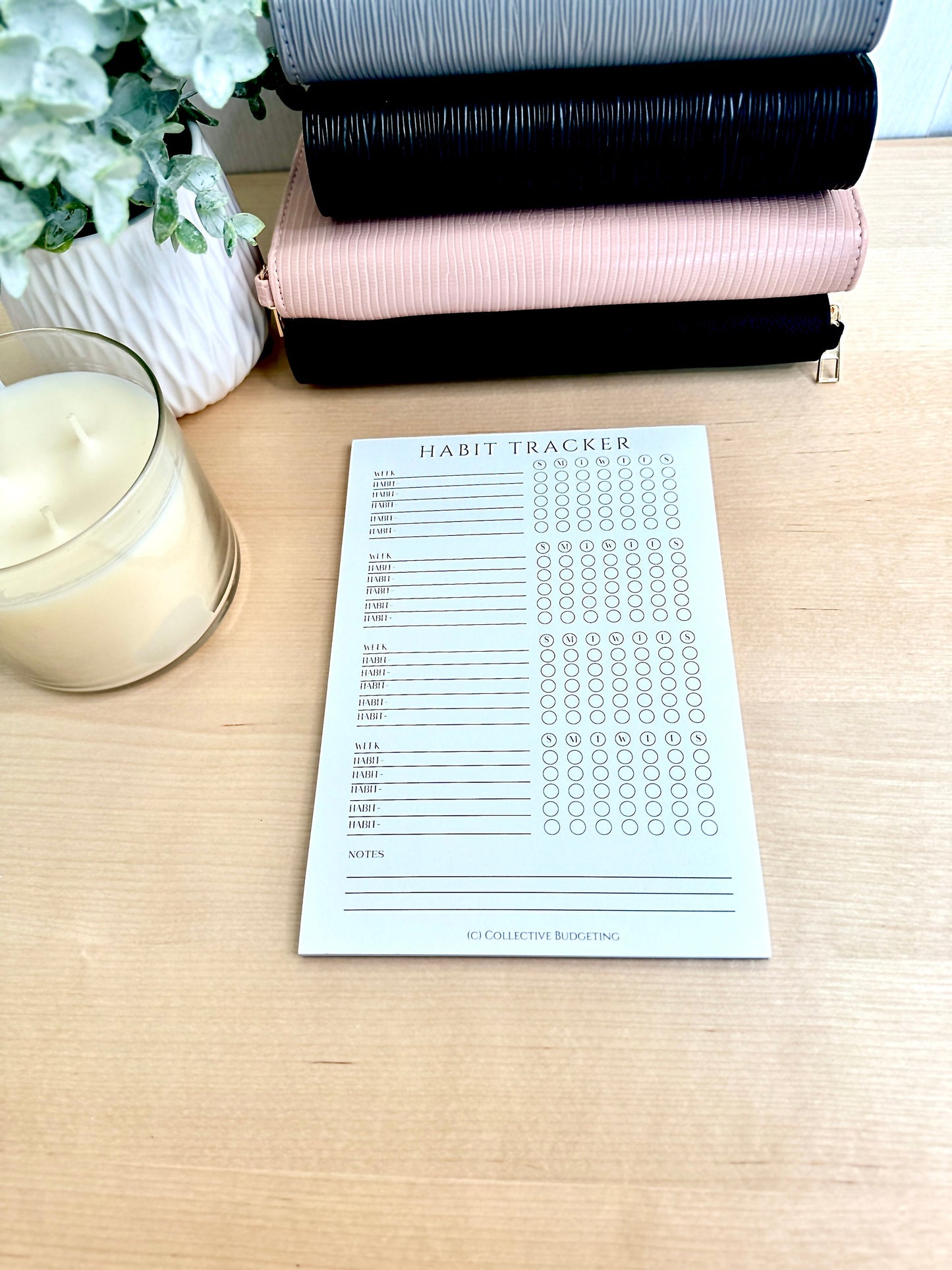 A white habit tracker with black text. The tracker has a column for each day of the week and rows for different habits. The text on the tracker reads 'HABIT TRACKER', 'WEEK', 'HAB1', 'HAB2', 'HAB3', 'HAB4', 'HAB5', 'HAB6', 'HAB7', 'HAB8', 'HAB9', 'HAB10', 'HAB11', 'HAB12', 'HAB13', 'HAB14', 'HAB15', 'HAB16', 'HAB17', 'HAB18', 'NOTES&#