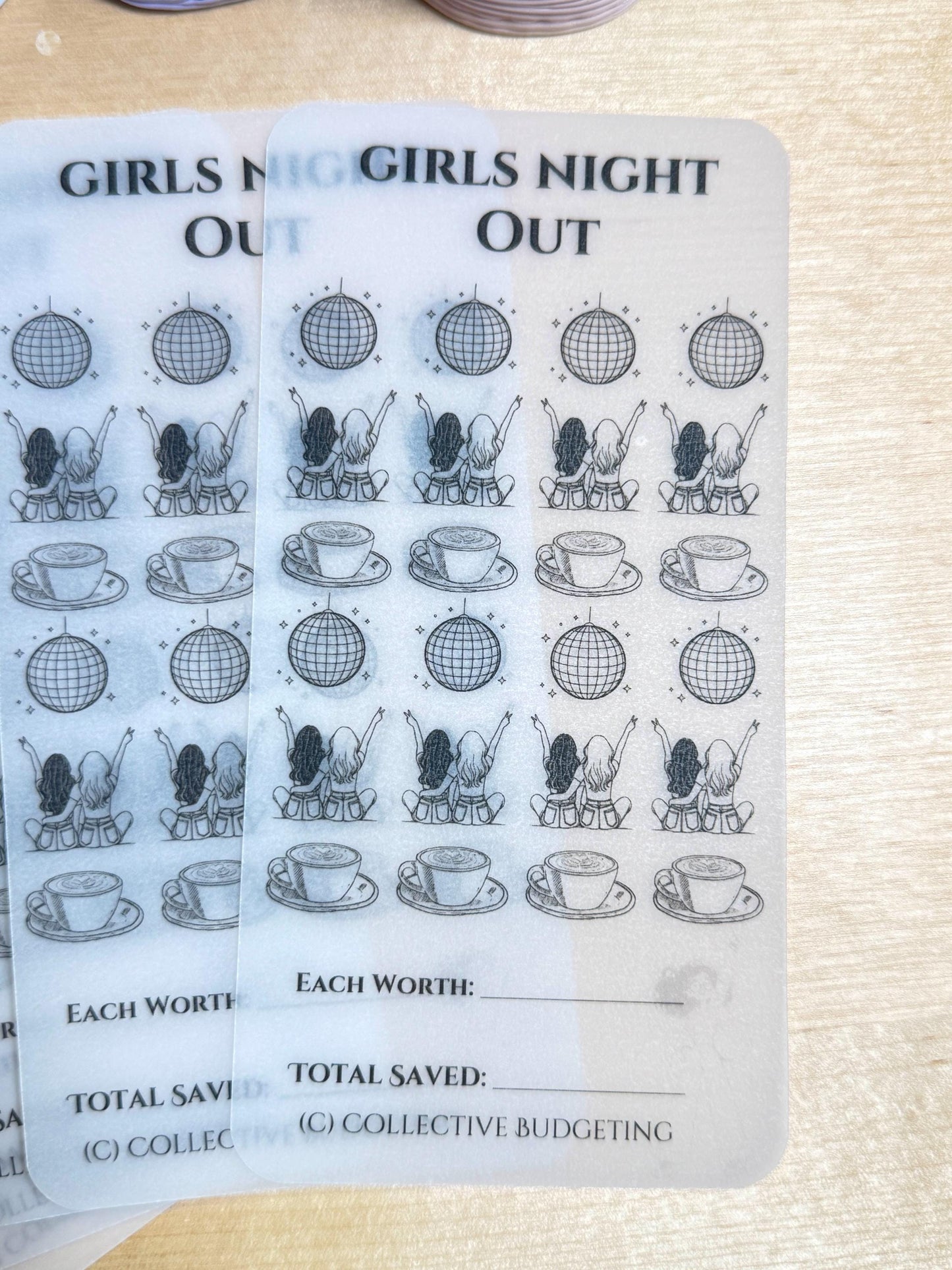 A white sticker sheet with a black and white design. The sticker sheet is for a girls night out and has a design of two girls with their arms up in the air, a disco ball, and a cup of coffee. The text on the sticker sheet reads 'Girls Night Out', 'Each Worth', 'Total Saved', and '(C) Collective Budgeting'.