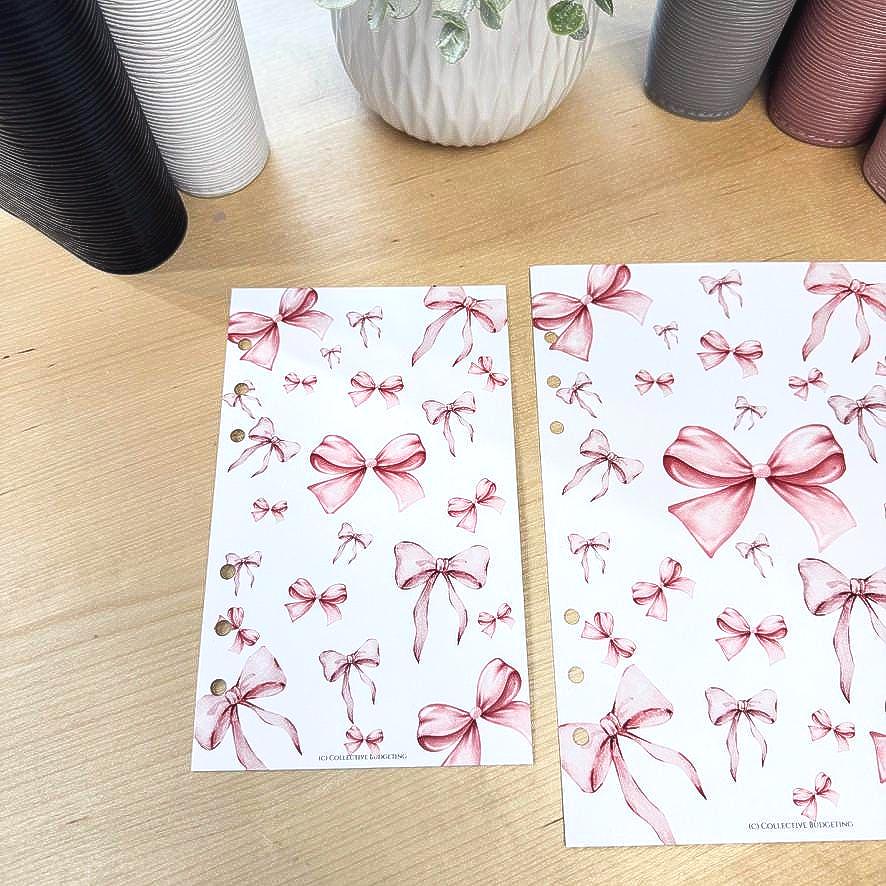 Two sheets of pink and white paper with a repeating pattern of pink watercolor bows. The text on the sheets reads 'IC Collective Planning'.