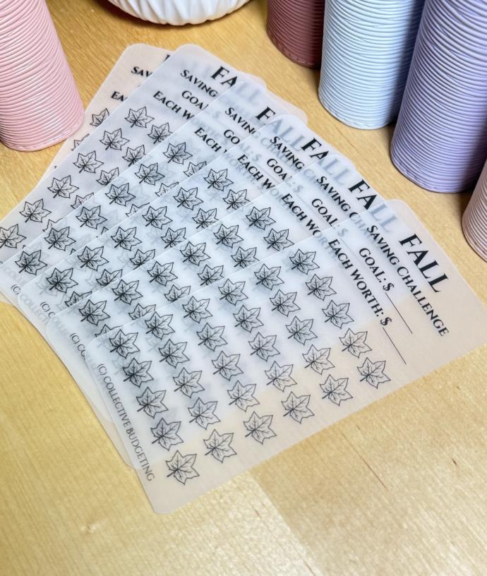 six white printable spring saving challenge tracker with black text. The text reads 'SPRING SAVING CHALLENGE', 'GOAL: $', 'EACH WORTH: $'. There are 36 black and white flower icons on the tracker. The bottom of the tracker reads '(C) COLLECTIVE BUDGETING'.